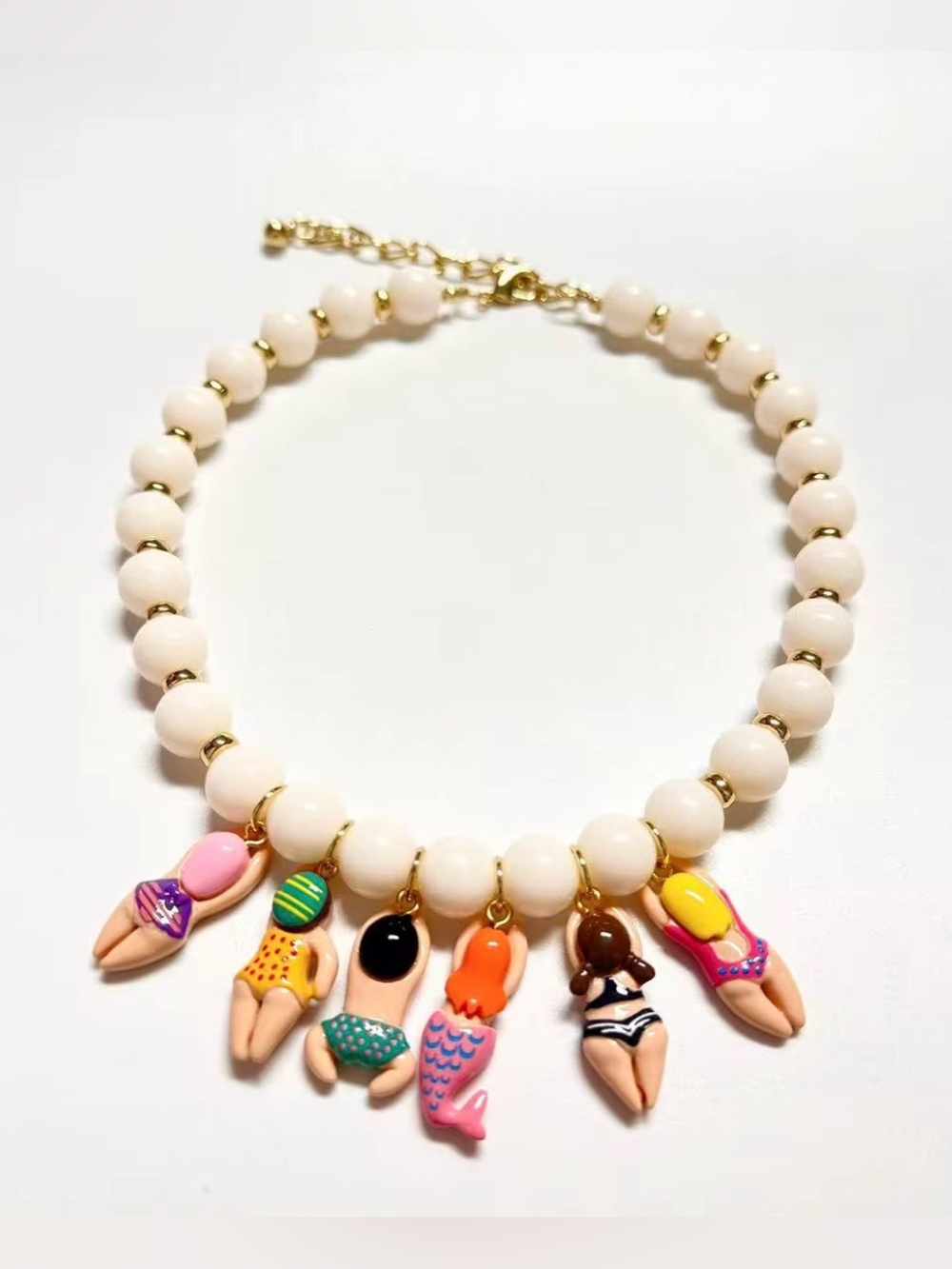 Women’s White Beaded Necklace with Colorful Charm Swimmers - - Picture 2 of 2